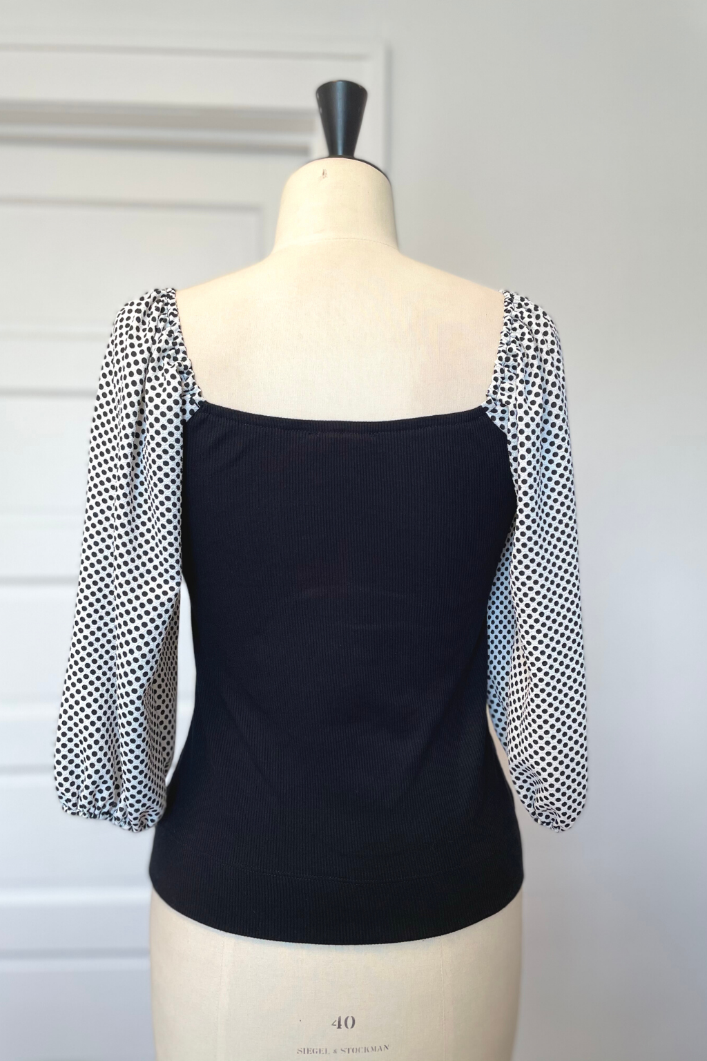 KOKOON Hutton Square Neck Top in Black Rib Knit With White and Black Polka Dot Sleeves Back