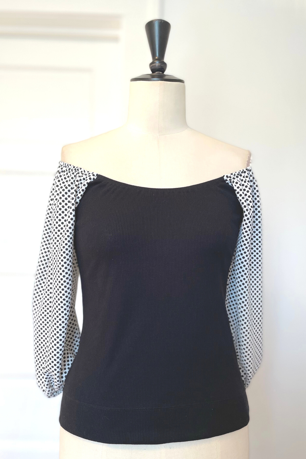 KOKOON Hutton Square Neck Top in Black Rib Knit With White and Black Polka Dot Sleeves Off Shoulder Front